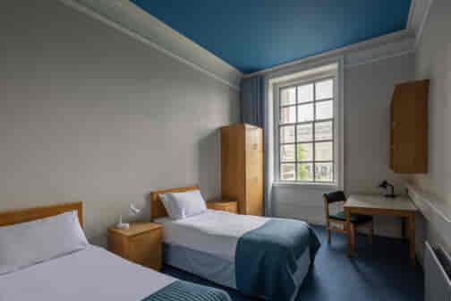 heritage ensuite twin room with beds and window in trinity college dublin