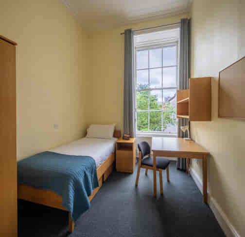 heritage ensuite single room with bed and window in trinity college dublin