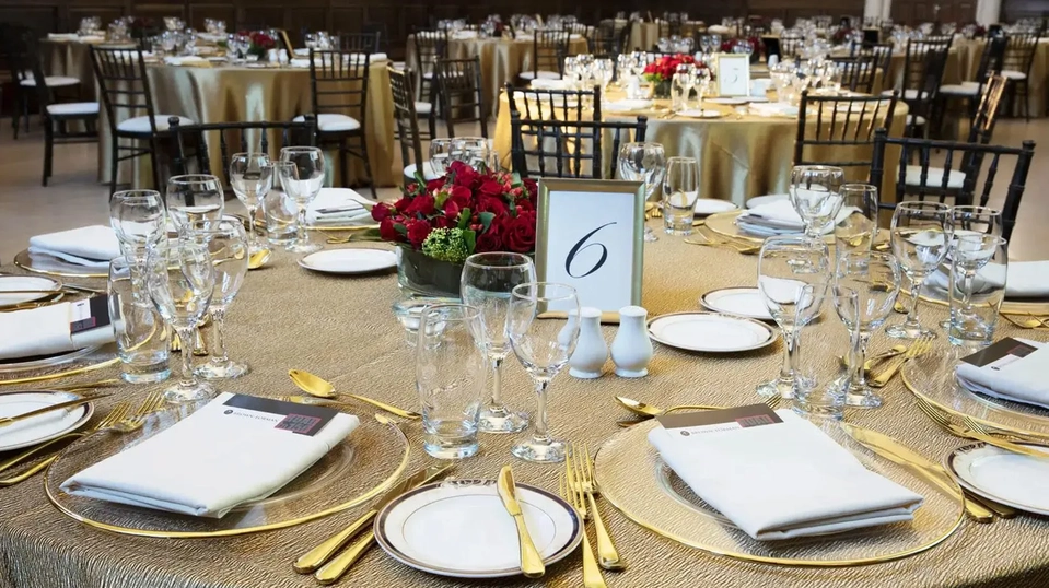 gold place settings on an ornate table arrangement