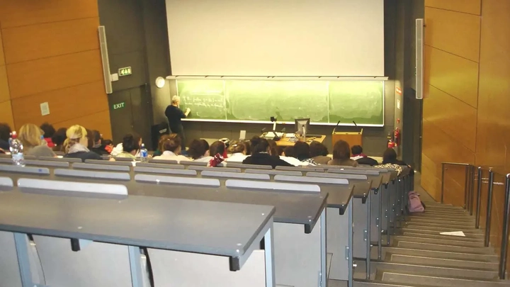 students and teacher at a lecture