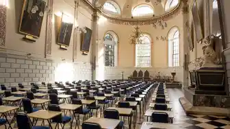 chairs and tables in rows at trinity exam hall